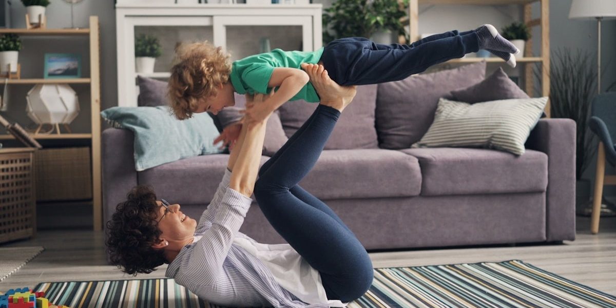 a woman and a child playing on the floor