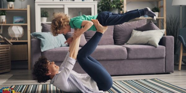 a woman and a child playing on the floor